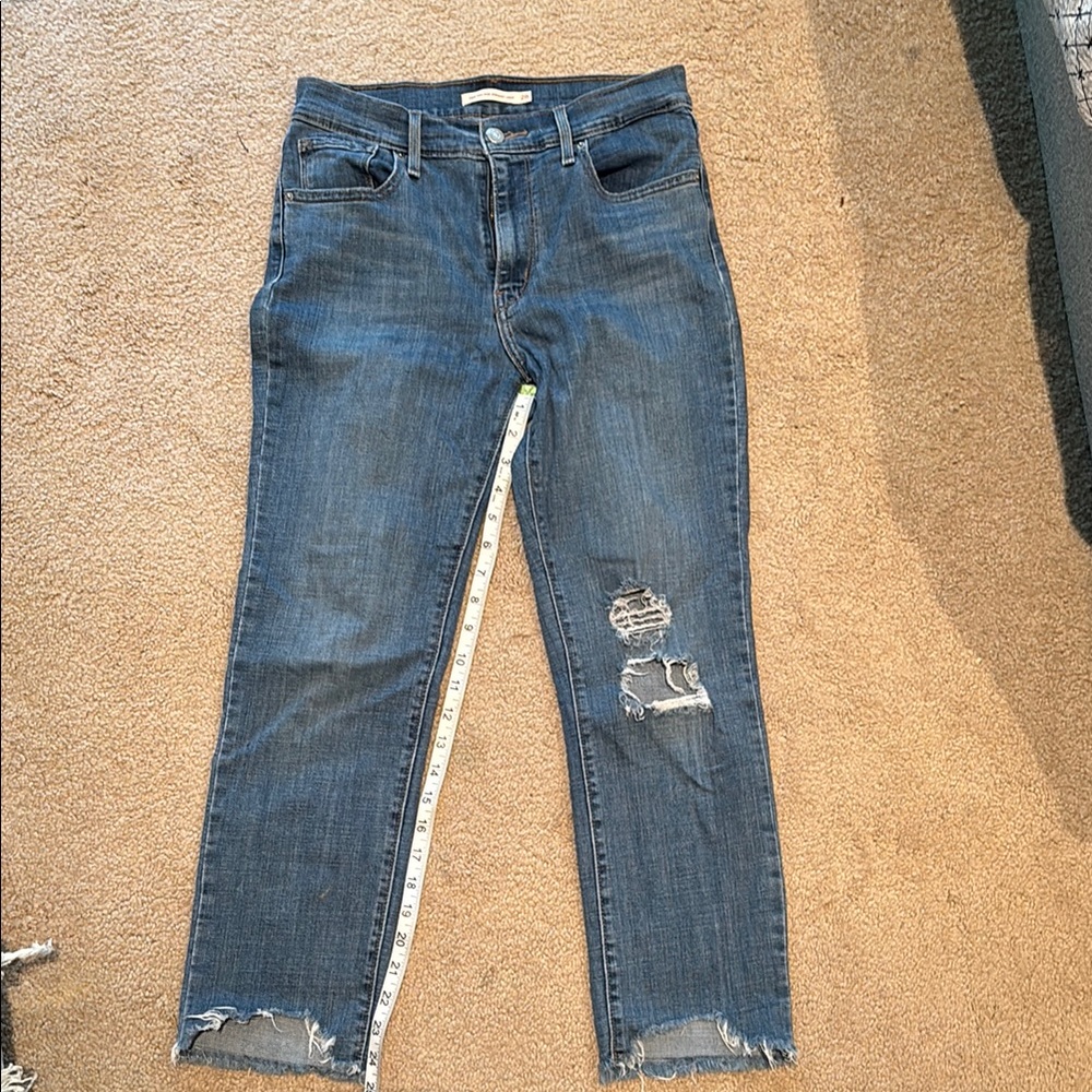 Distressed Levi’s 724 Blue Jeans